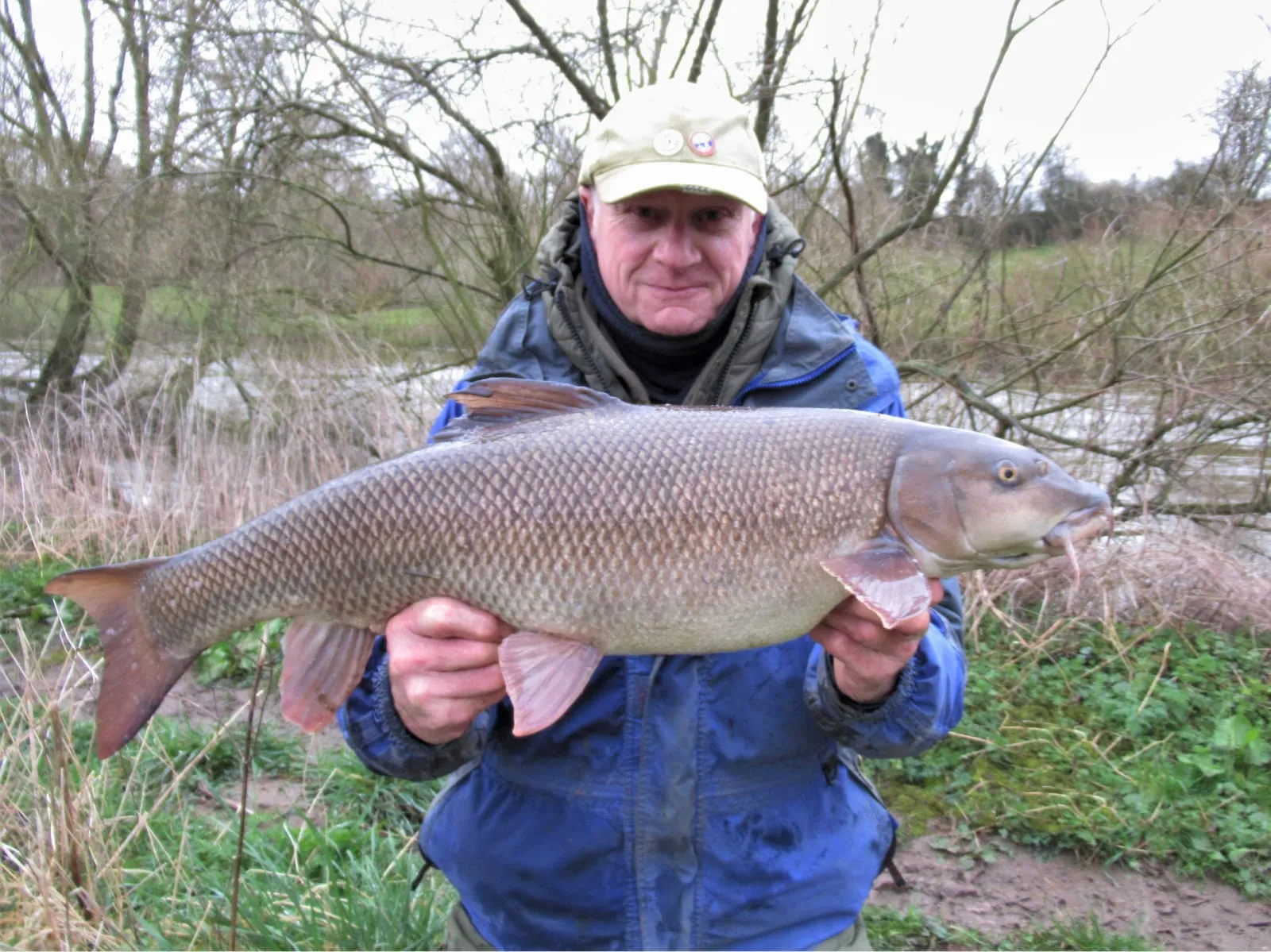 Roger Carswell holding his 13lb 10oz club record barbel