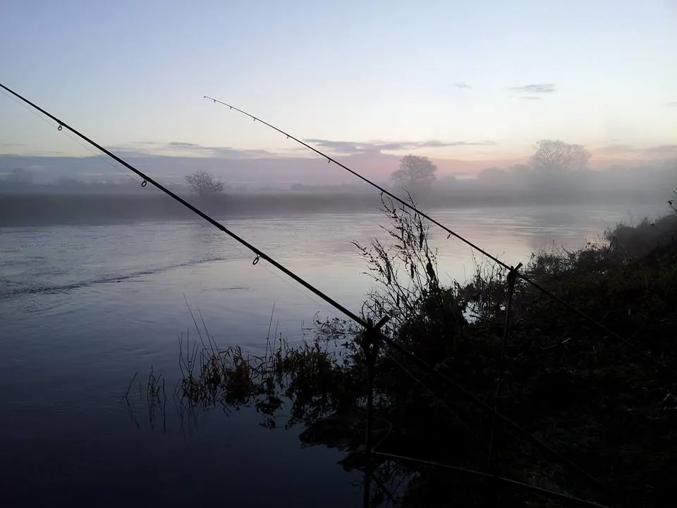 Rods set up at dawn over a misty River Severn